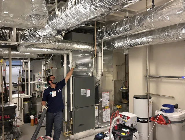 West Warwick Air Duct Cleaning specialist performing thorough furnace duct cleaning in a West Warwick residence