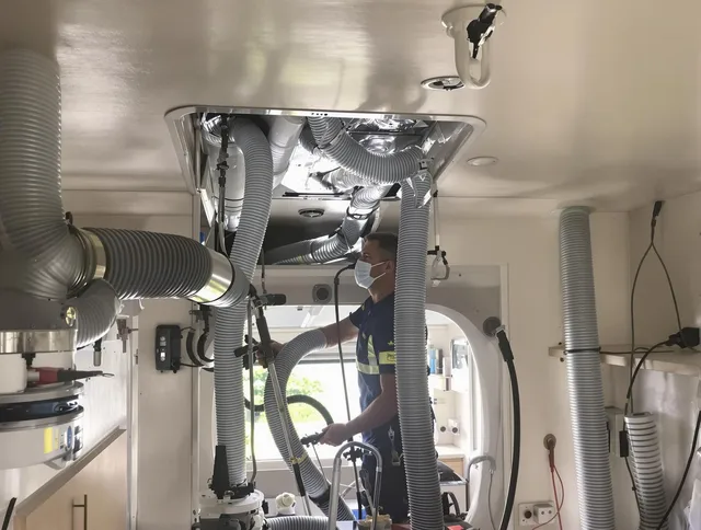 West Warwick Air Duct Cleaning specialist performing precise mobile home duct cleaning in West Warwick