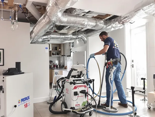 West Warwick Air Duct Cleaning technician performing advanced pure duct cleaning with specialized equipment in West Warwick