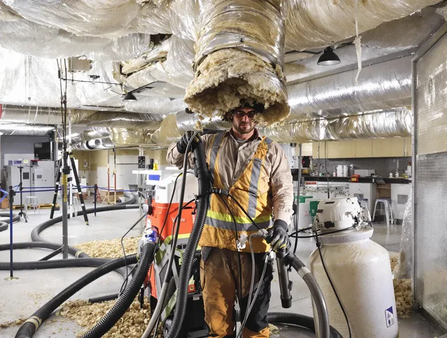Professional vacuum insulation removal by West Warwick Air Duct Cleaning expert in West Warwick